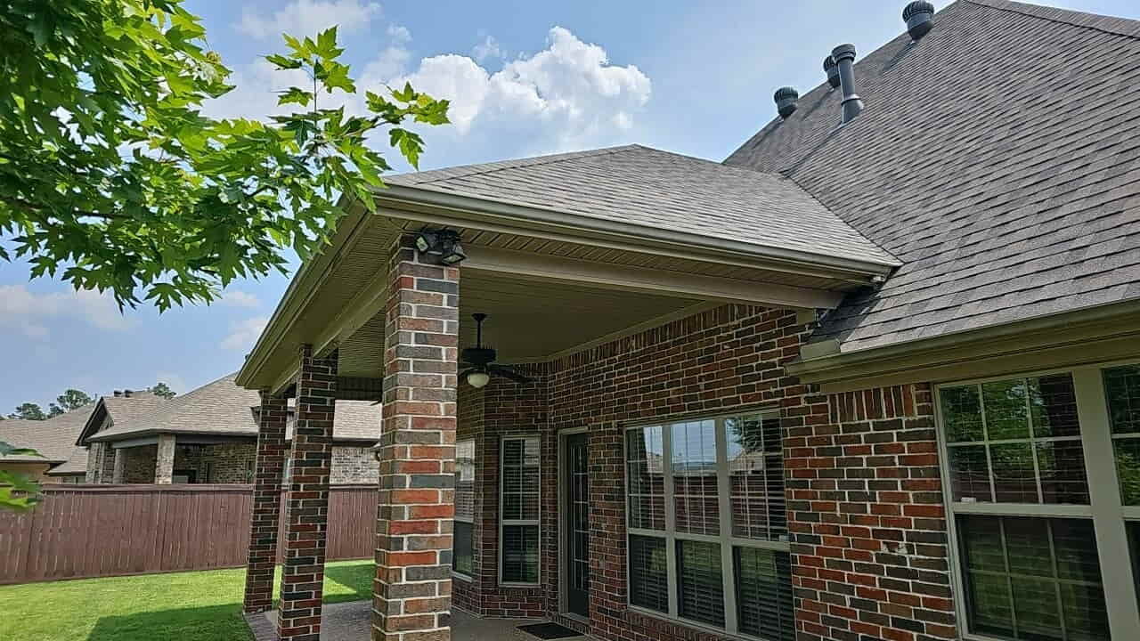 New shingle roof and gutters on a brick home