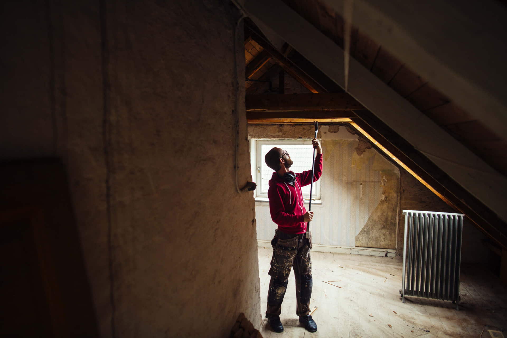 Homeowner adding insulation in an attic