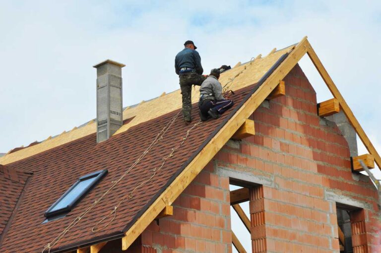 Atlas certified roofing contractor installing shingles on a home