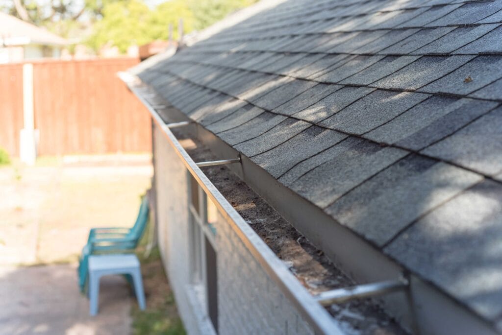 improper gutters causing foundation damage in Arkansas clay soil