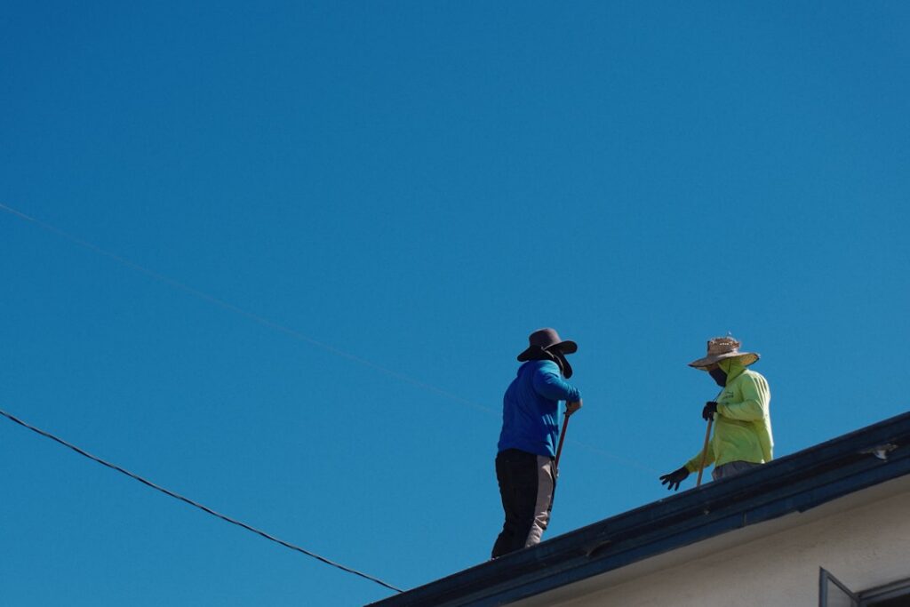 roofing contractor inspecting residential roof in Arkansas