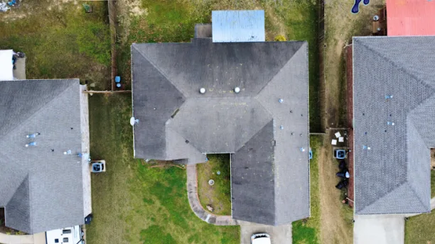 Grey shingle roof after a completed replacement