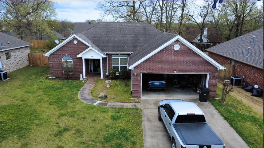Brick home after a completed roof replacement