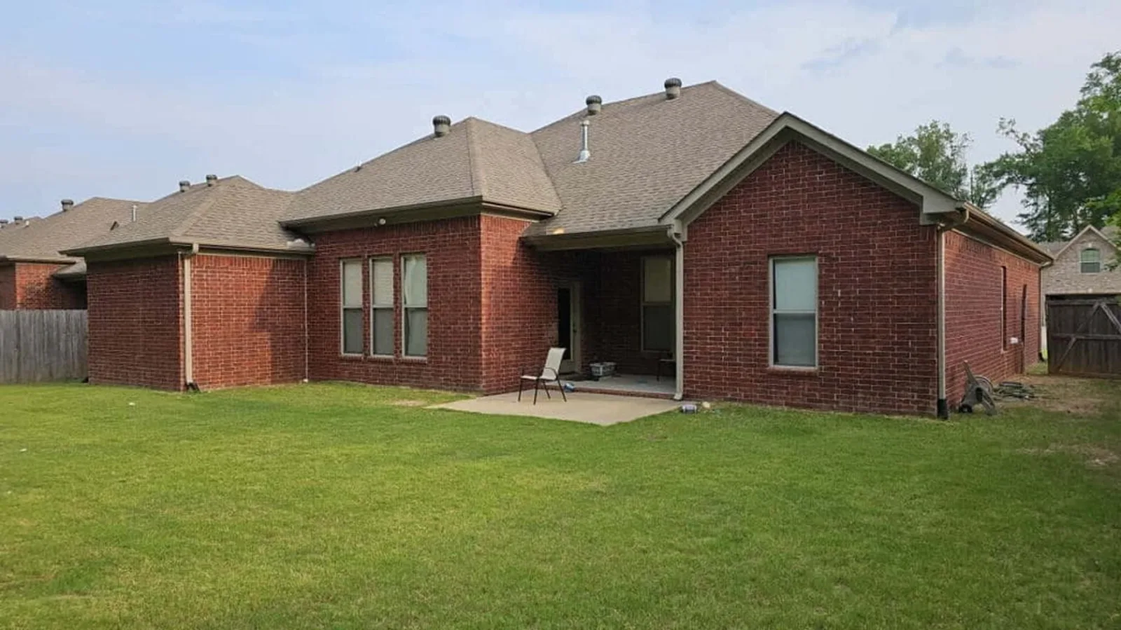 Brick ranch home with a new shingle roof