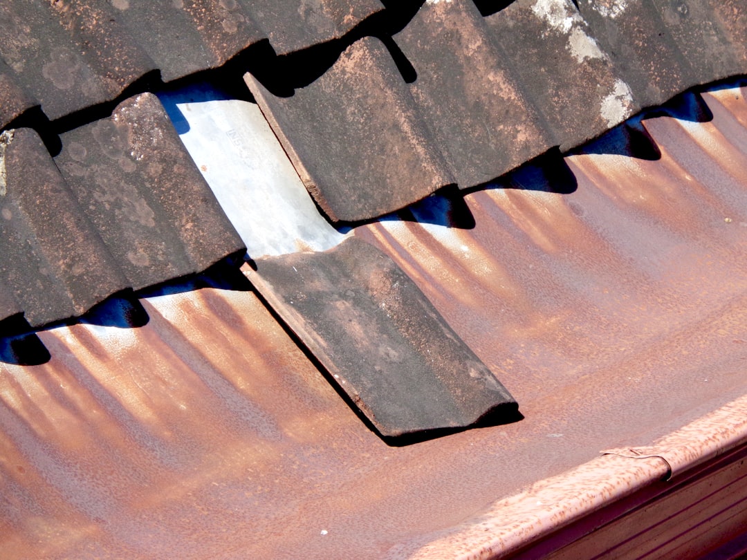 damaged shingles and roof flashing inspection