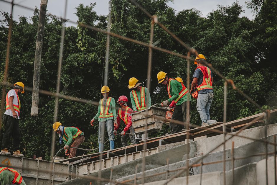 roofing crew working on a steep-pitched roof