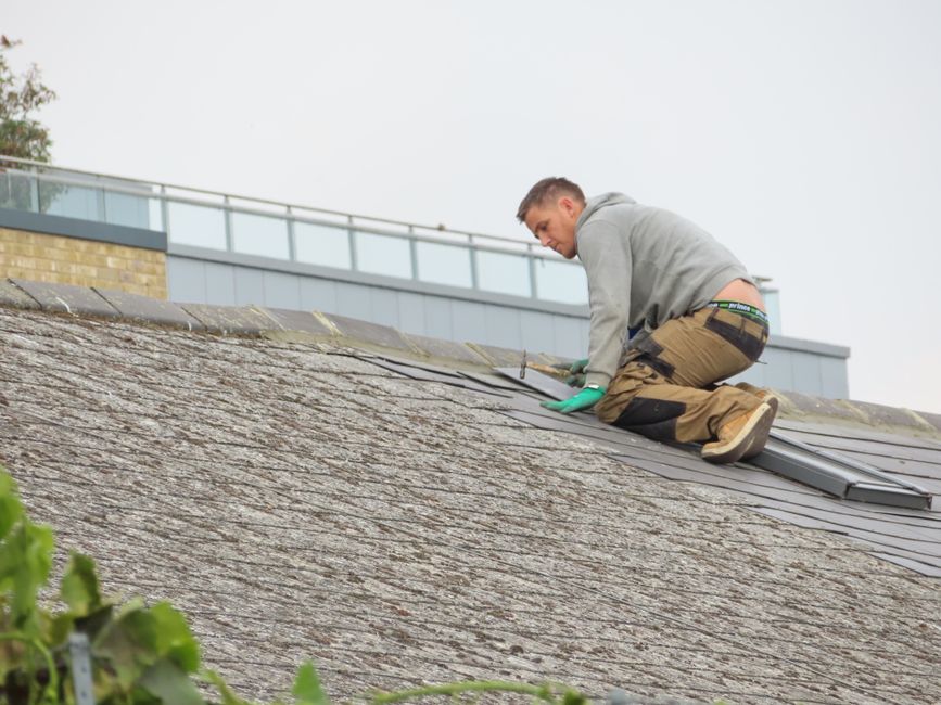 professional roof inspector examining shingles for damage professional roof inspector examining shingles for damage